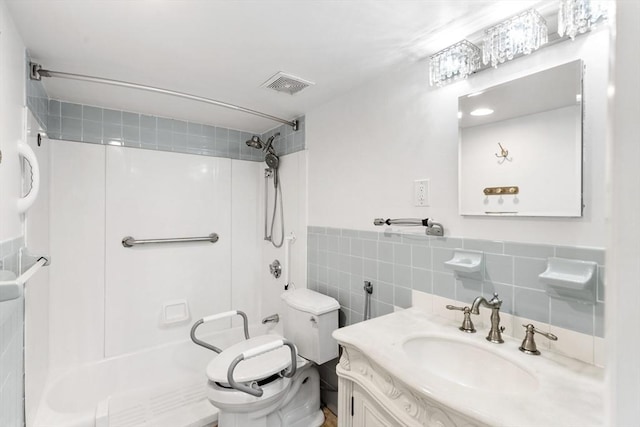 53 Melrose St Unit 7F, Melrose, MA 02176 - bathroom with toilet, tile walls, vanity, shower / bathtub combination, and wainscoting