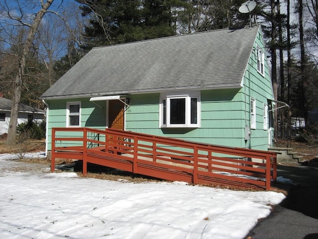 view of front of house with a shingled roof