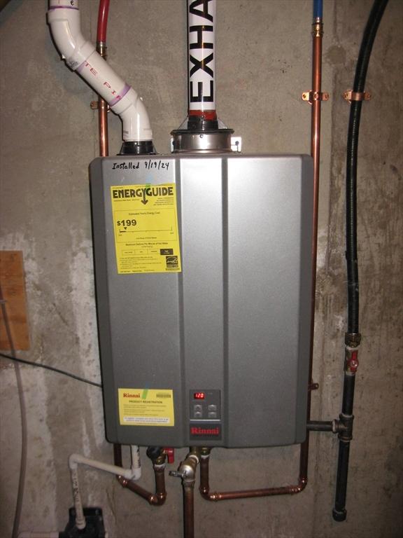 utility room featuring water heater