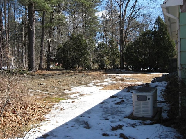 view of yard layered in snow