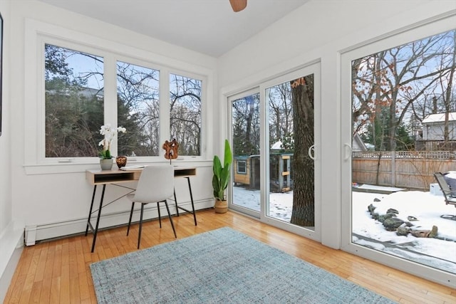 sunroom featuring baseboard heating