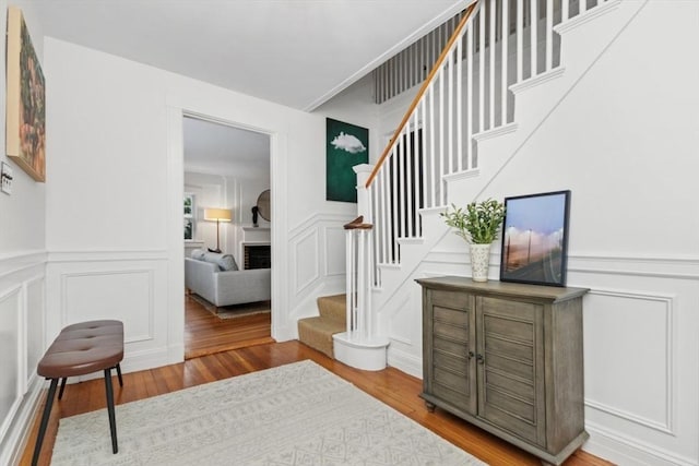 staircase featuring wood-type flooring