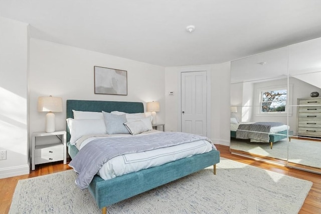 bedroom with wood-type flooring