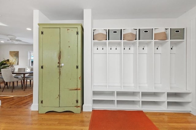 mudroom with light hardwood / wood-style flooring and ceiling fan