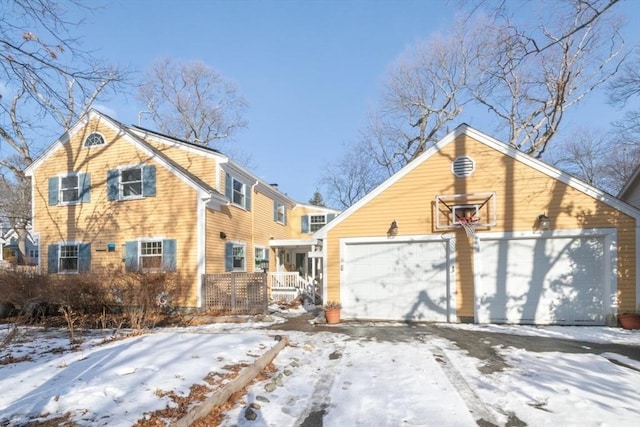 exterior space with a garage and covered porch