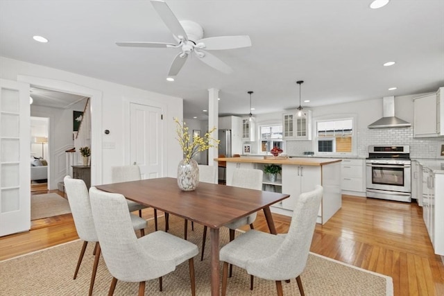 dining area featuring ceiling fan and light hardwood / wood-style flooring