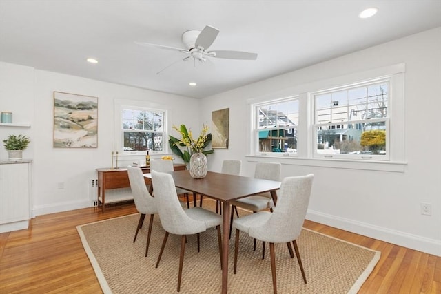 dining room featuring ceiling fan and light hardwood / wood-style flooring