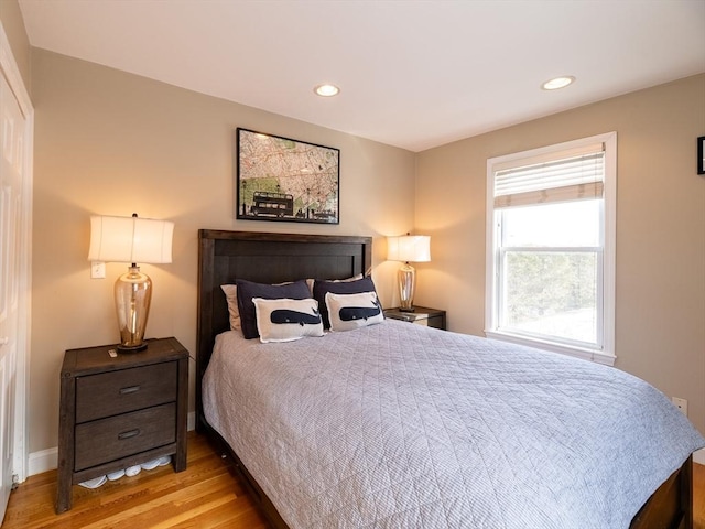 bedroom with light hardwood / wood-style floors