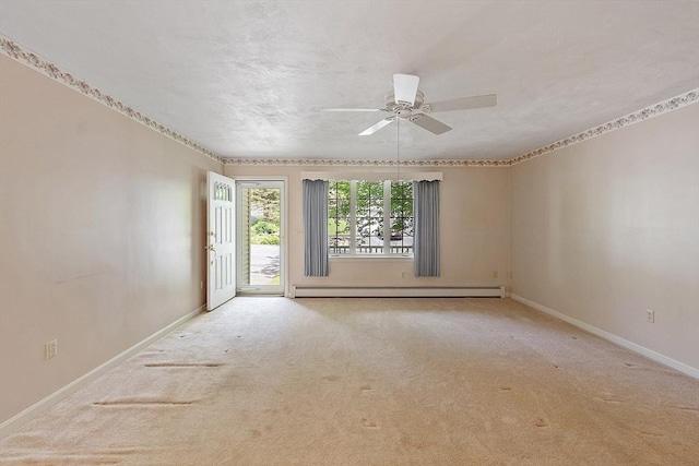 43 Warwick Rd, Gardner, MA 01440 - empty room with a baseboard heating unit, a ceiling fan, carpet flooring, and baseboards