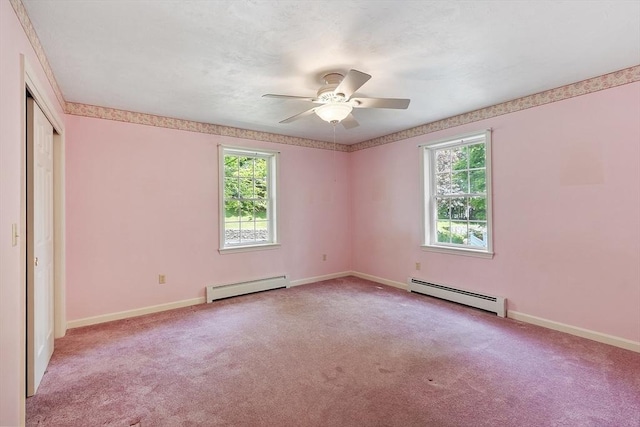 43 Warwick Rd, Gardner, MA 01440 - unfurnished bedroom with a baseboard radiator, multiple windows, and carpet floors