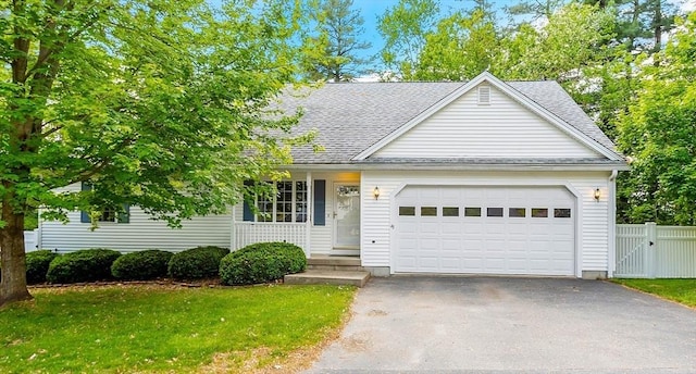 43 Warwick Rd, Gardner, MA 01440 - view of front of house featuring asphalt driveway, an attached garage, roof with shingles, and a gate