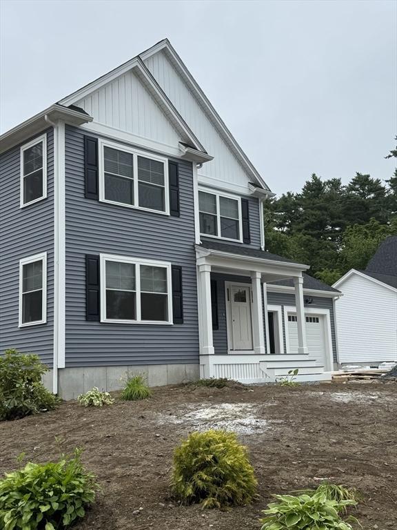 9 Patten Rd, Norton, MA 02766 - view of front of house with covered porch and board and batten siding
