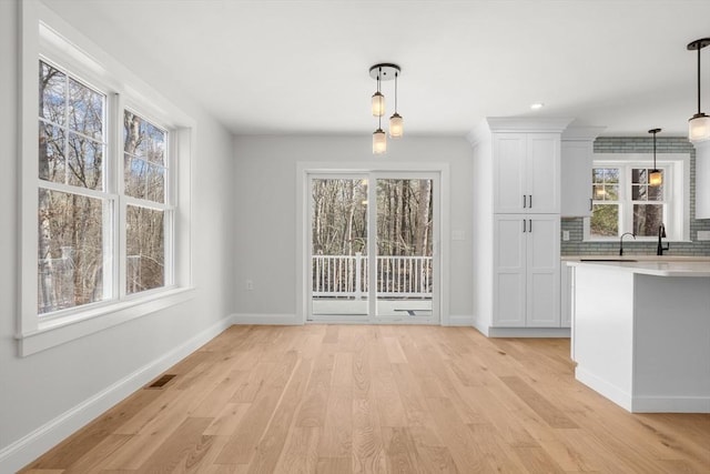 9 Patten Rd, Norton, MA 02766 - unfurnished dining area with light wood-style floors and baseboards