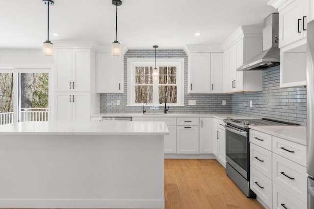 9 Patten Rd, Norton, MA 02766 - kitchen featuring wall chimney range hood, appliances with stainless steel finishes, decorative backsplash, white cabinetry, and recessed lighting