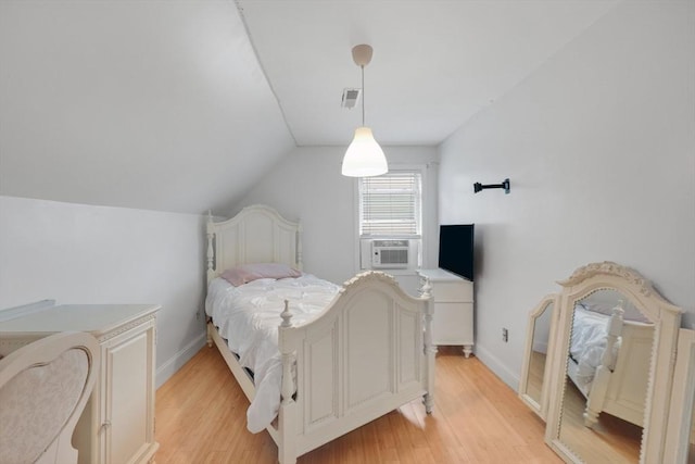 45 Olney Ave, Springfield, MA 01119 - bedroom with light wood-style flooring, vaulted ceiling, and cooling unit