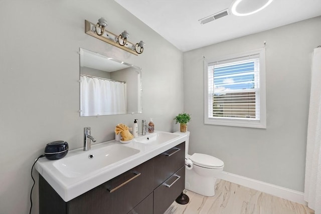 45 Olney Ave, Springfield, MA 01119 - bathroom with double vanity and marble look tile flooring