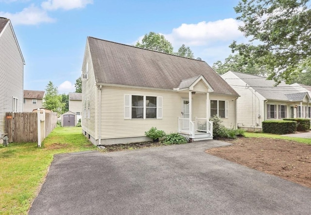 45 Olney Ave, Springfield, MA 01119 - cape cod-style house with a storage unit and a shingled roof