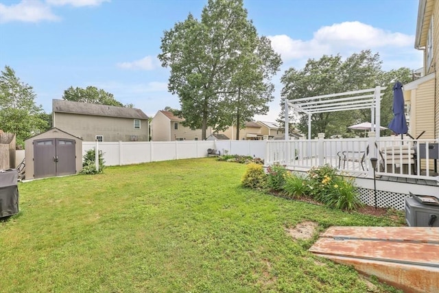 45 Olney Ave, Springfield, MA 01119 - fenced backyard with a storage unit, a pergola, and a deck