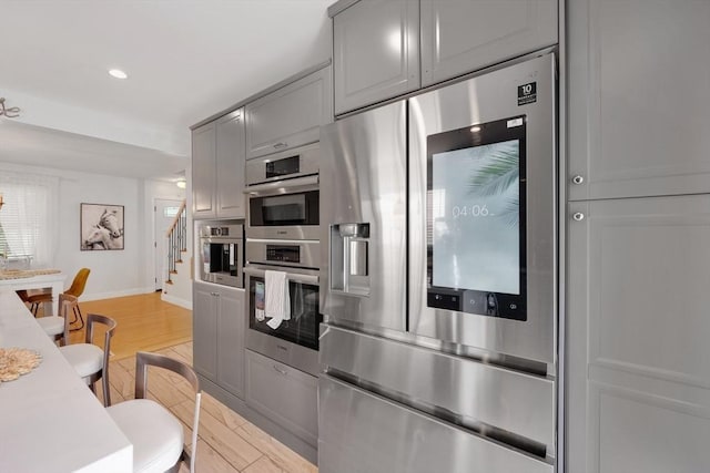 45 Olney Ave, Springfield, MA 01119 - kitchen featuring stainless steel appliances, gray cabinets, recessed lighting, light wood finished floors, and light countertops