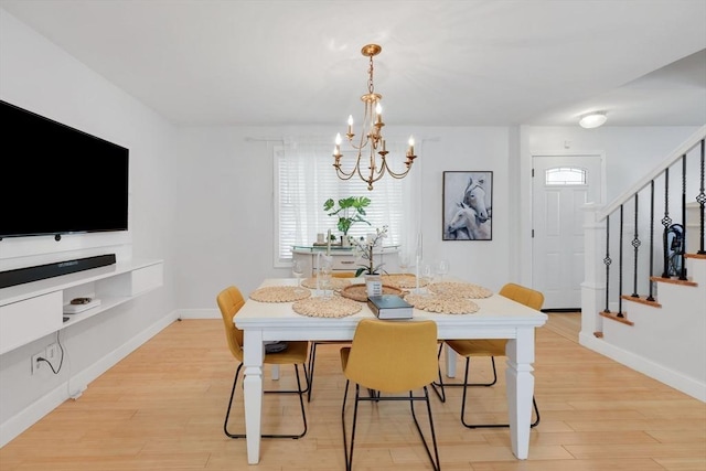 45 Olney Ave, Springfield, MA 01119 - dining area with a chandelier, stairs, and light wood finished floors