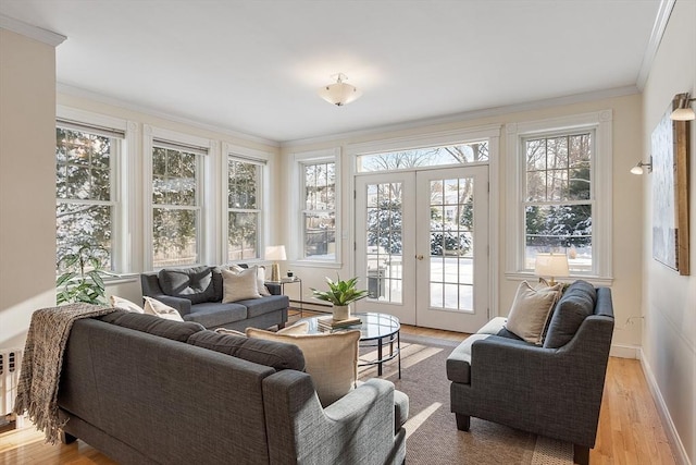 sunroom / solarium featuring french doors