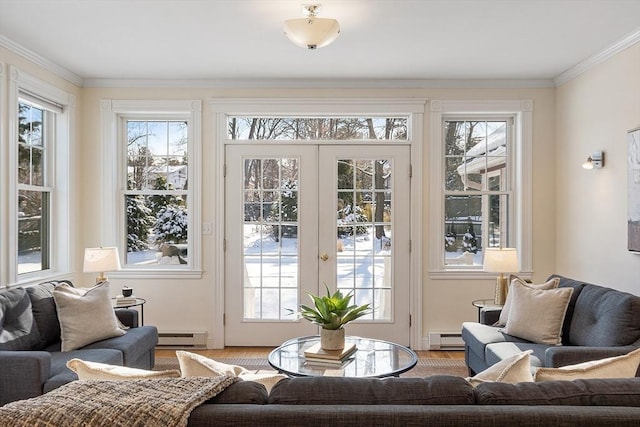 doorway to outside with baseboard heating, hardwood / wood-style floors, crown molding, and french doors