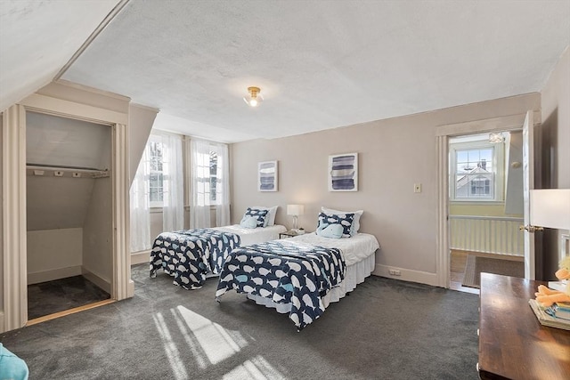 carpeted bedroom featuring a closet and vaulted ceiling