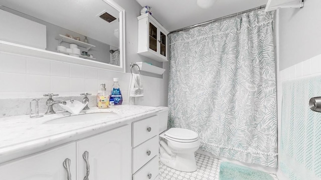 10 Williams St Unit 26, Watertown, MA 02472 - full bath with vanity, toilet, tile walls, and curtained shower