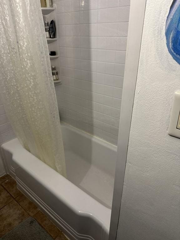 bathroom with shower / tub combo and tile patterned floors