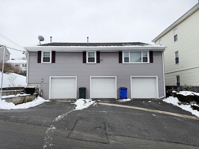 exterior space featuring driveway and an attached garage