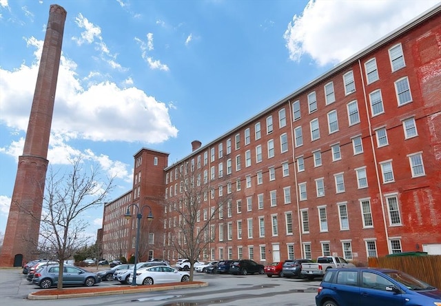 52 Lawrence Dr Unit 312, Lowell, MA 01854 - view of building exterior with uncovered parking
