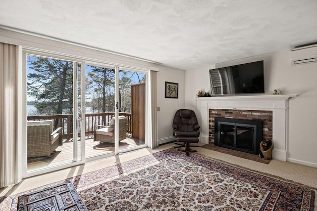 1 Calico Cir Unit 1, Dennis, MA 02639 - living area with baseboards, a textured ceiling, a wall unit AC, and a fireplace