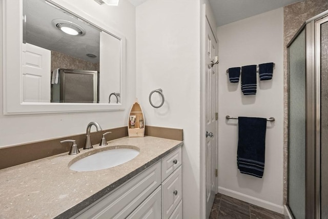 1 Calico Cir Unit 1, Dennis, MA 02639 - full bathroom with vanity, baseboards, and a shower stall