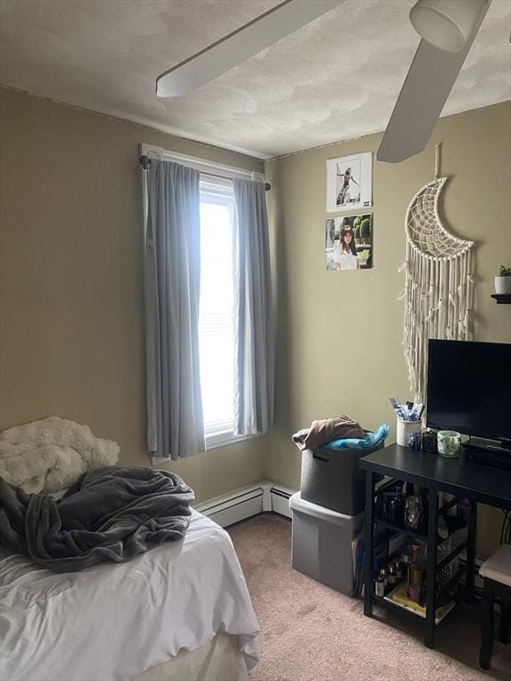 bedroom with carpet floors and a textured ceiling