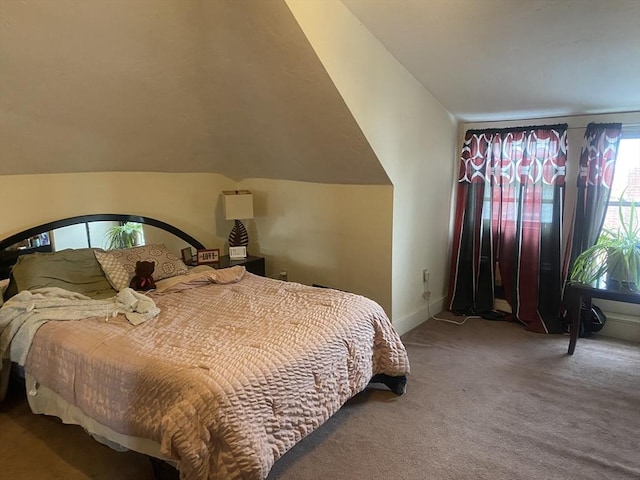 bedroom featuring carpet flooring, vaulted ceiling, and baseboards