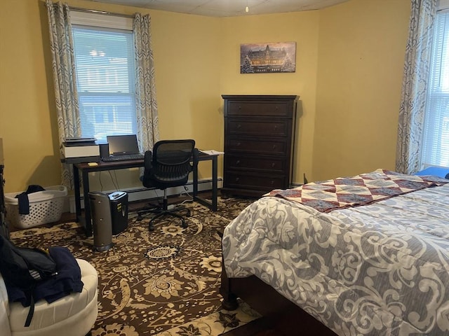 bedroom featuring baseboards and baseboard heating