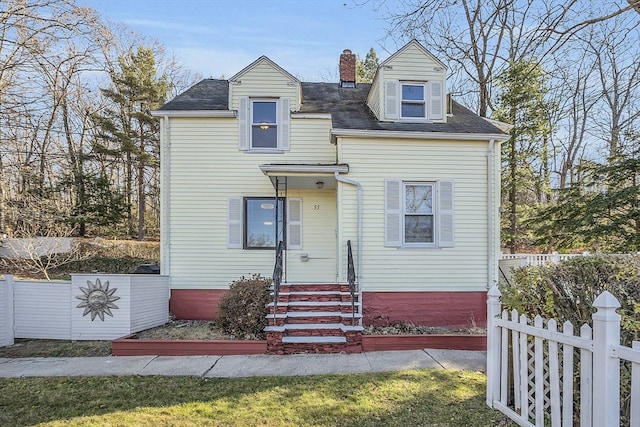 view of new england style home