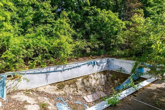326 Lake Rd, Ashburnham, MA 01430 - view of swimming pool with an empty pool and a view of trees