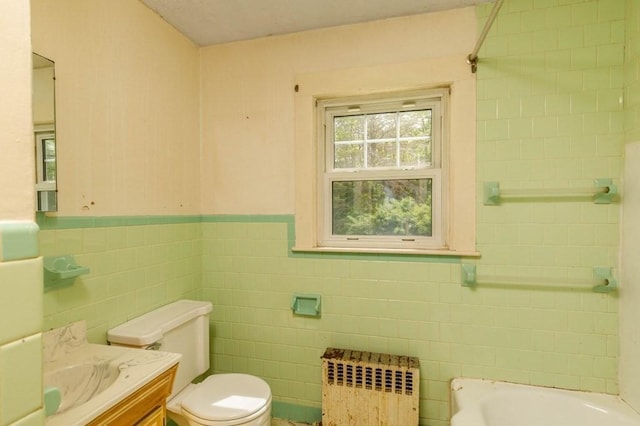 326 Lake Rd, Ashburnham, MA 01430 - full bath featuring tile walls, radiator, toilet, vanity, and a wainscoted wall