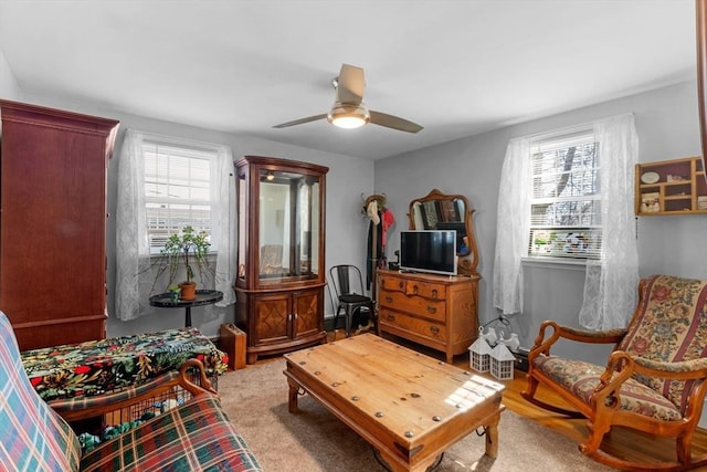 sitting room featuring a healthy amount of sunlight and ceiling fan