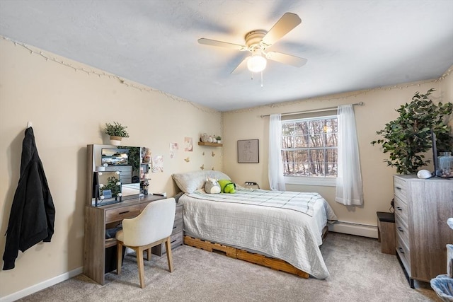 bedroom featuring light carpet, a baseboard heating unit, and ceiling fan