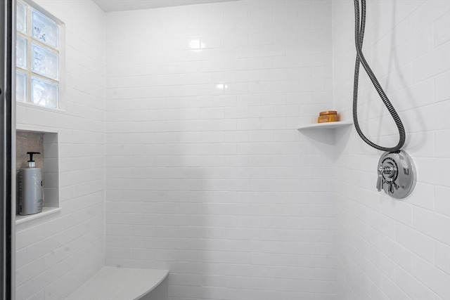 bathroom featuring tiled shower