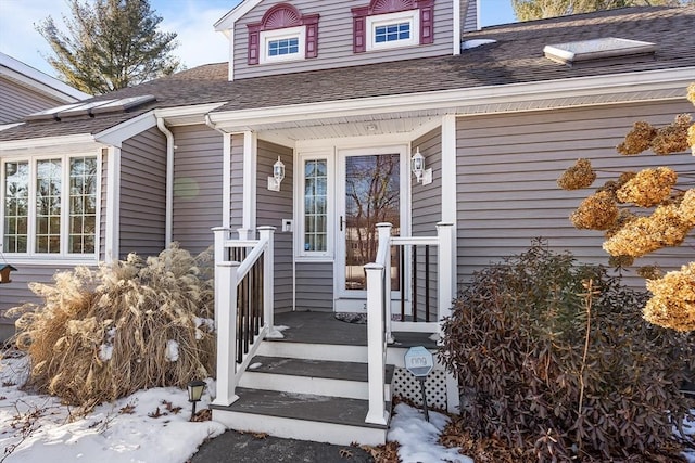 view of snow covered property entrance