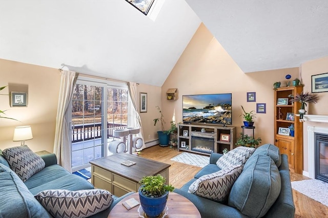 living room with a baseboard radiator, high vaulted ceiling, and light hardwood / wood-style floors