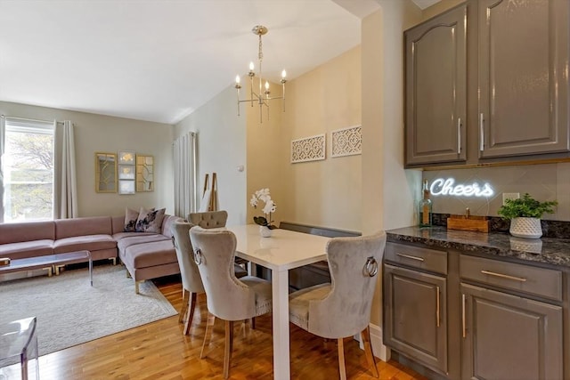 34 Warren St Unit 3, Stoneham, MA 02180 - dining room with a chandelier and light wood-style floors