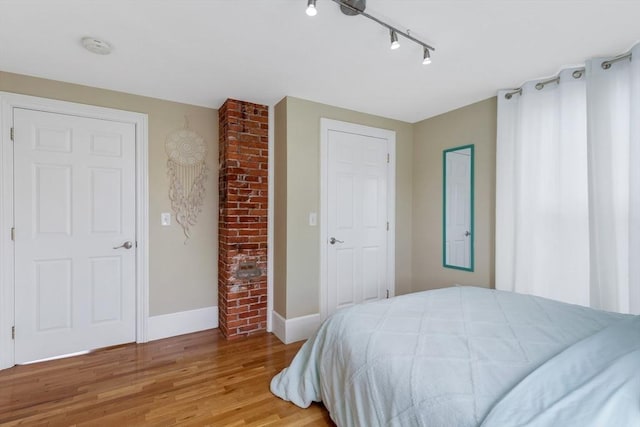 34 Warren St Unit 3, Stoneham, MA 02180 - bedroom featuring wood finished floors and track lighting