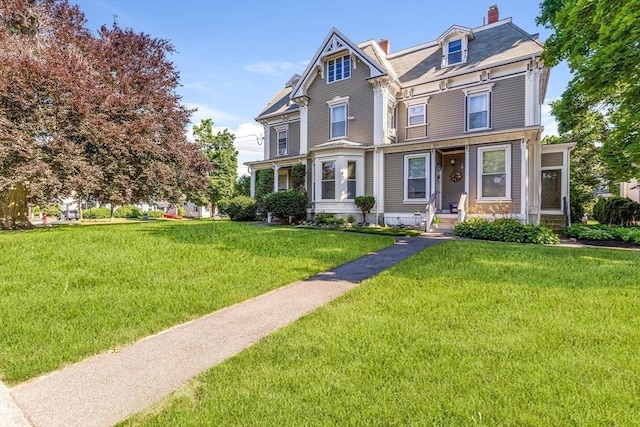 34 Warren St Unit 3, Stoneham, MA 02180 - view of front of property featuring a front yard, a porch, and a chimney