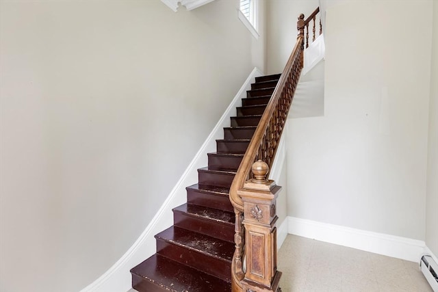 34 Warren St Unit 3, Stoneham, MA 02180 - stairway with a baseboard heating unit and tile patterned floors