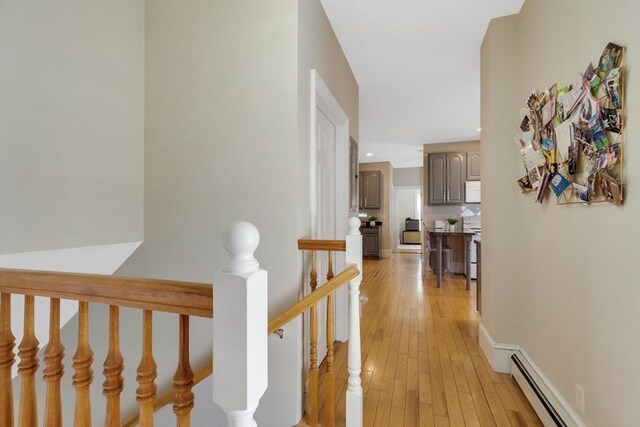 34 Warren St Unit 3, Stoneham, MA 02180 - hall with an upstairs landing, a baseboard radiator, light wood-type flooring, and recessed lighting