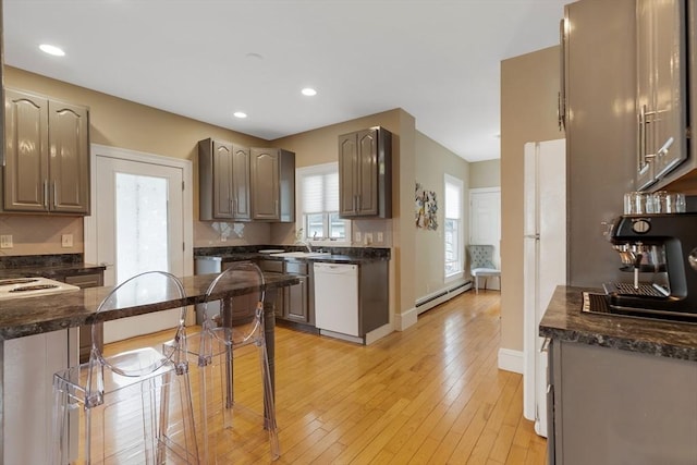 34 Warren St Unit 3, Stoneham, MA 02180 - kitchen featuring dishwasher, a baseboard radiator, light wood-type flooring, and recessed lighting